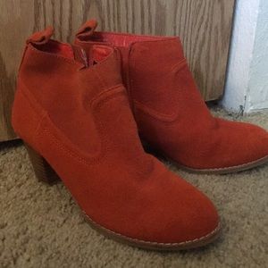 Orange heeled booties